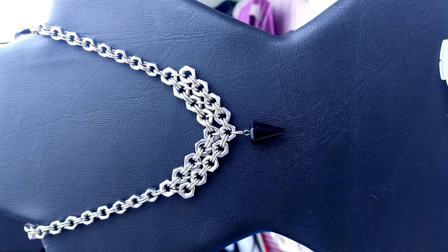 Nutz n Chains silver chain necklace statement with black pendant on black display