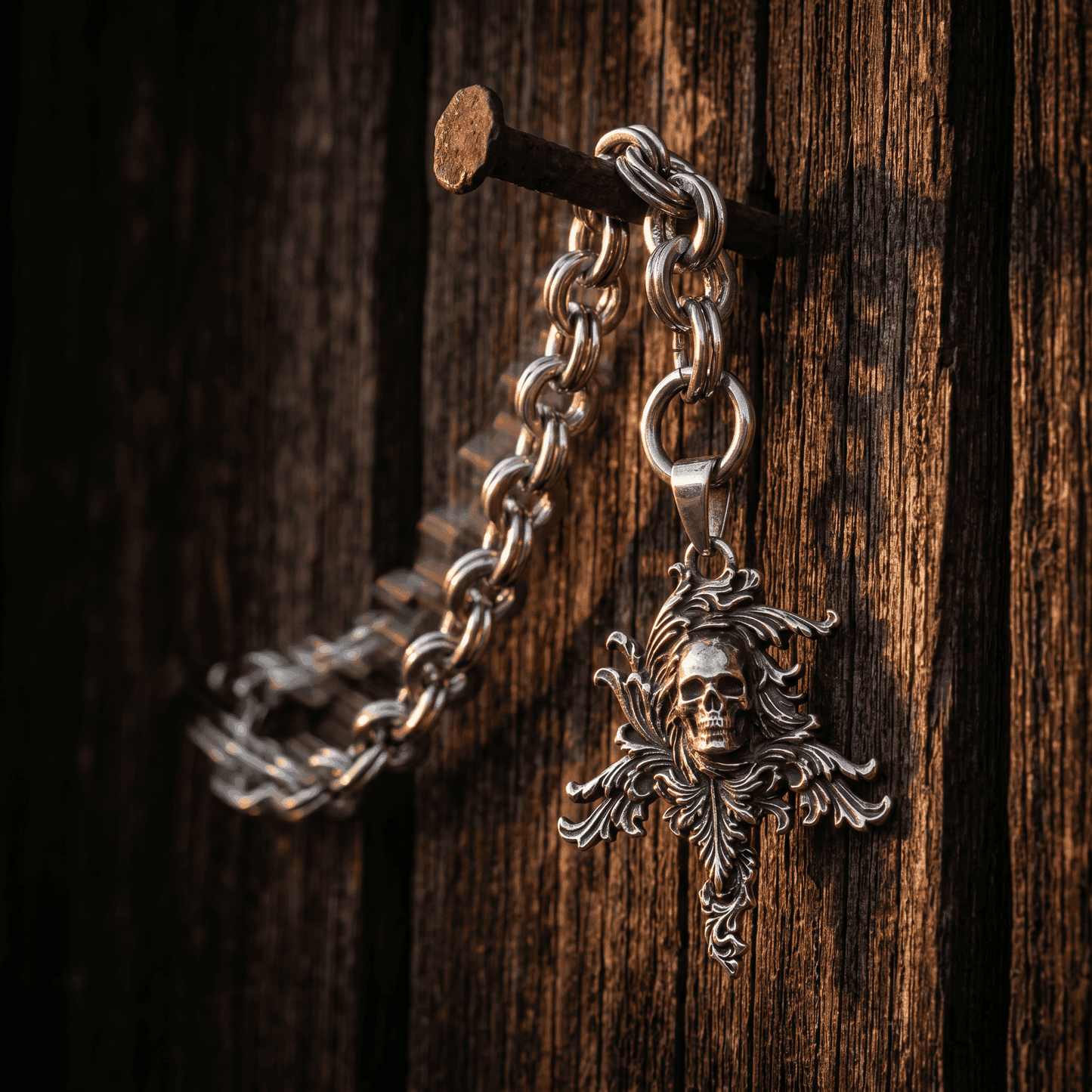 Nutz n Chains pendant necklace with skull design and chunky necklace chain hanging on rustic nail
