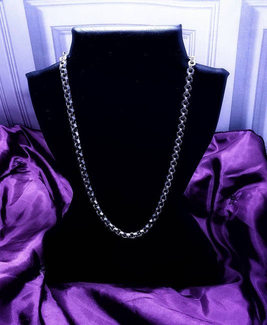 Silver chain necklace displayed on black bust with purple satin background by Nutz n Chains